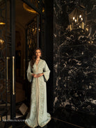 Jade Noctis full-length mint green Moroccan kaftan with embroidered belt