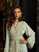 Jade Noctis mint green Moroccan kaftan with gold embroidery and wide sleeves